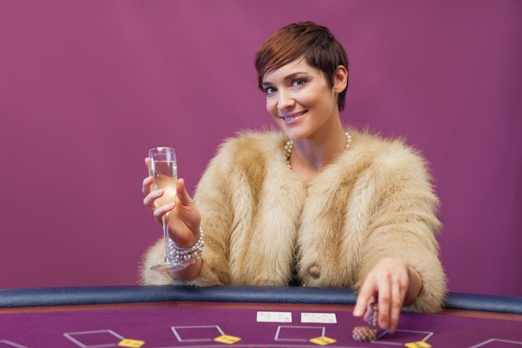 Live dealer blackjack table interface showing currency selector and balance in USD and IDR